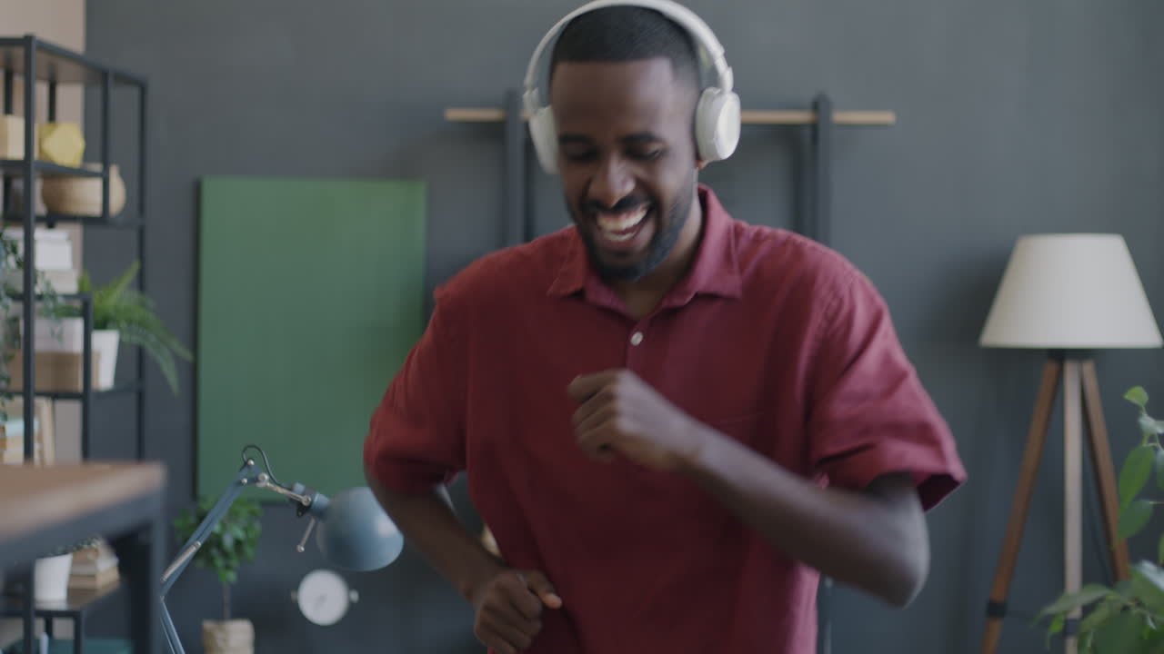 Man Dancing to Music at Home