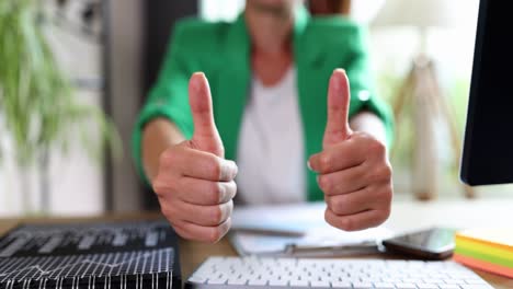 thumbs up gesture in office setting