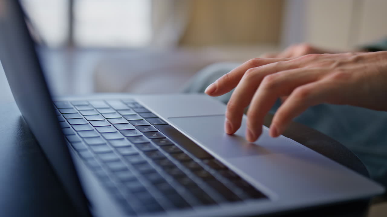 Manager hand swiping laptop touchpad in remote workplace closeup. Man working
