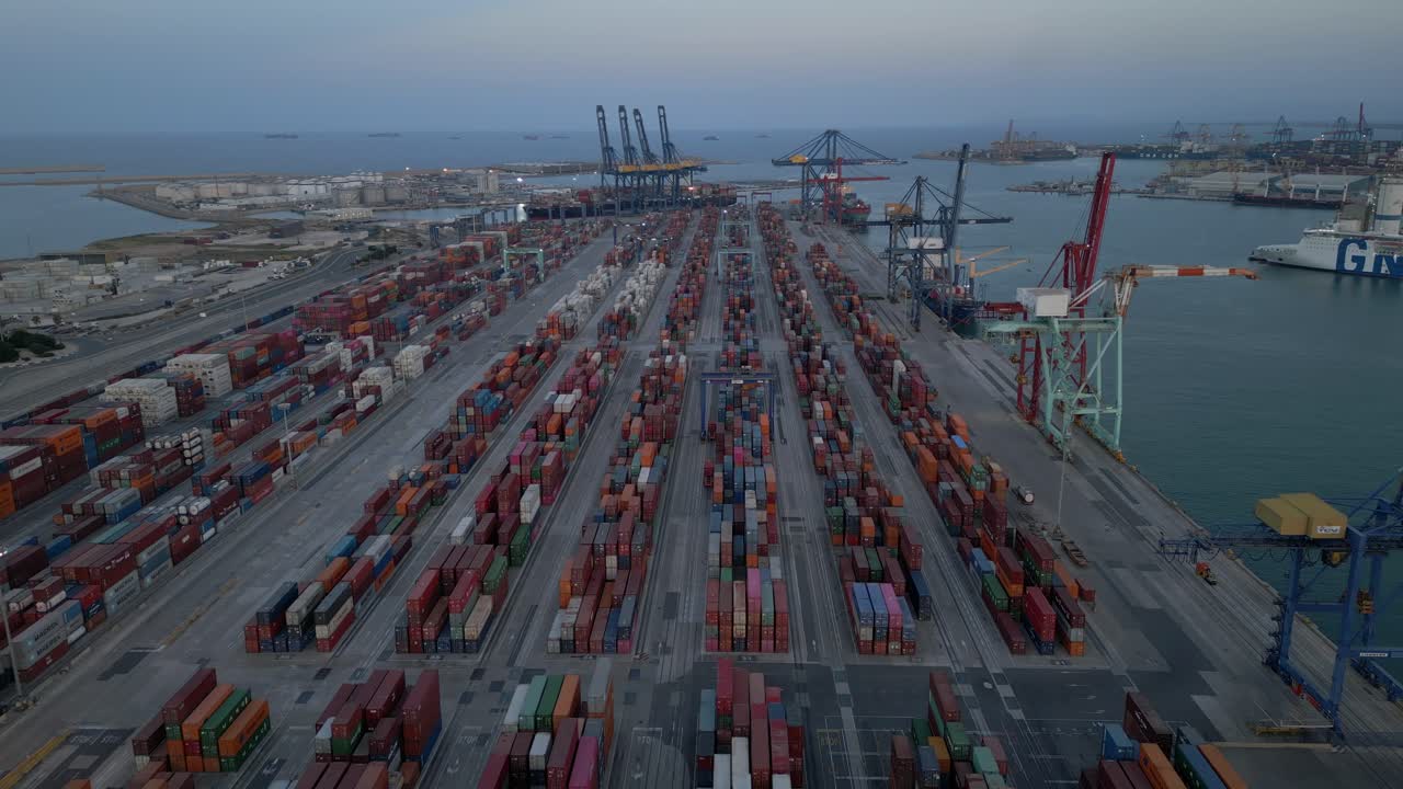 Wide Aerial view of shipping port at dusk, evening in Valencia, Spain