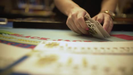 Closeup-hands,-croupier-shuffling-cards-in-casino-,-croupier-playing-tricks-with-cards-,-casino-betting-life