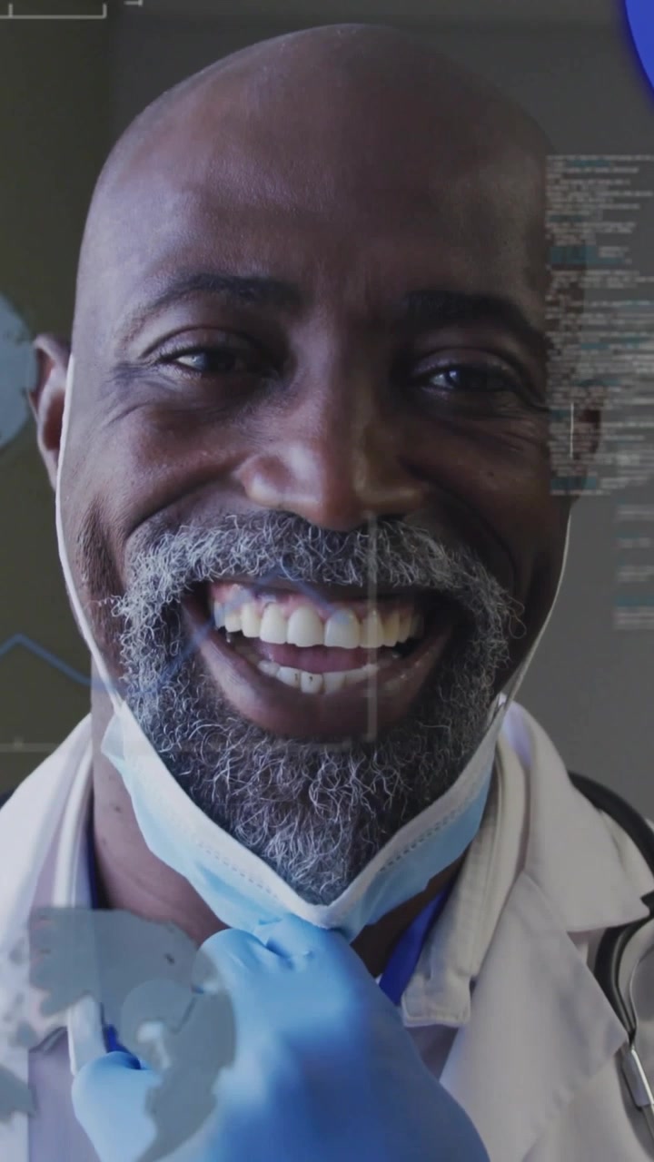 Vertical video: Doctor lowering mask after gloved touch to mask, revealing smile, charts overlaying