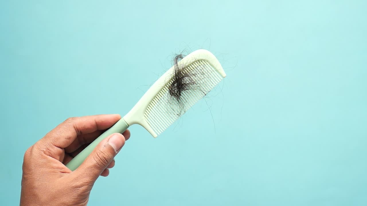 Man hold his list hair close up ,