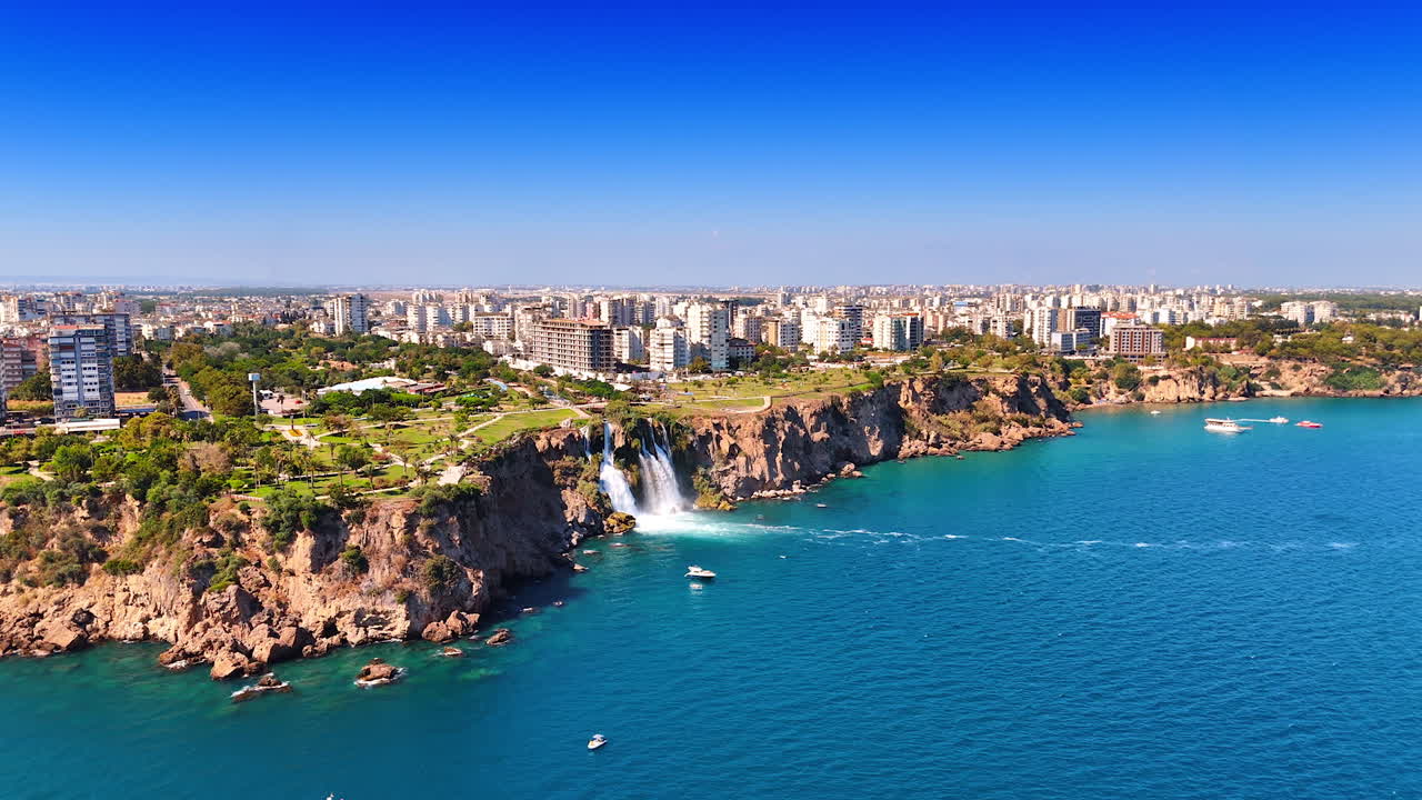The Duden Waterfalls located in the Antalya Province, southern Turkey. Beautiful natural wonder and a popular tourist attraction. Drone footage above the waterscape of the Mediterranean Sea