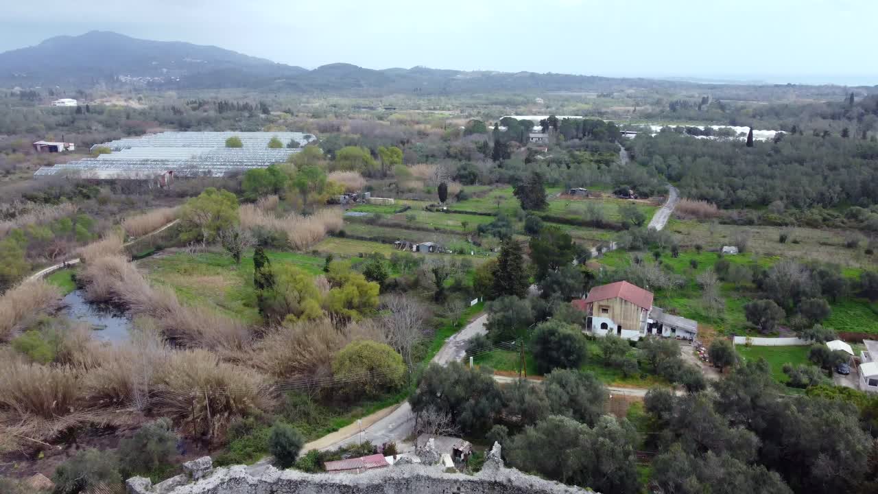 Fantastic aerial view flight slowly sinking down drone footage ruins of a byzantine fortress of 13th century wild nature Corfu Greece