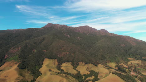 Breathtaking-aerial-view-of-Pico-dos-Marins-mountain-and-lush-valleys-under-a-bright-blue-sky