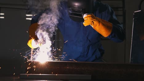 metal welder working with arc welding machine