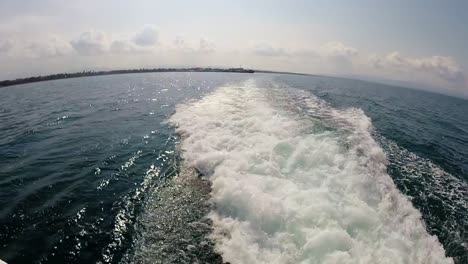 Wake-created-by-ferry-boat-that-has-left-port,-Hilongos,-Leyte,-Philippines