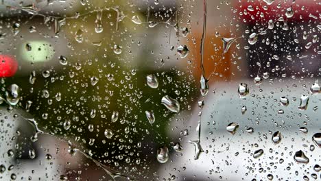 looking out at the street through glass with raindrops