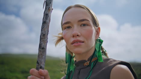 travel woman resting highlands at cloudy sky closeup. smiling girl look camera