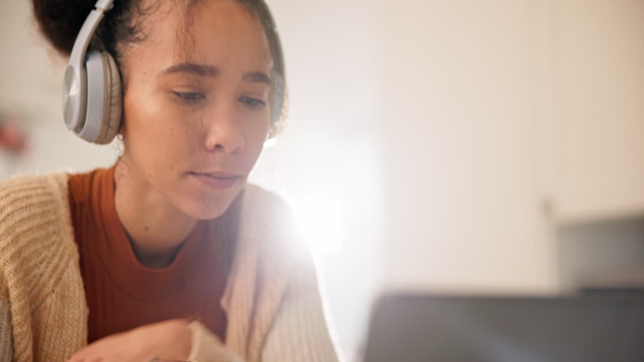 Headphones, laptop and woman in home