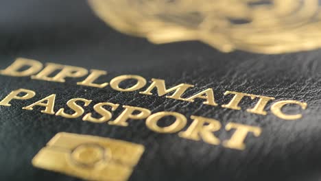 close-up of a diplomatic passport with gold embossing