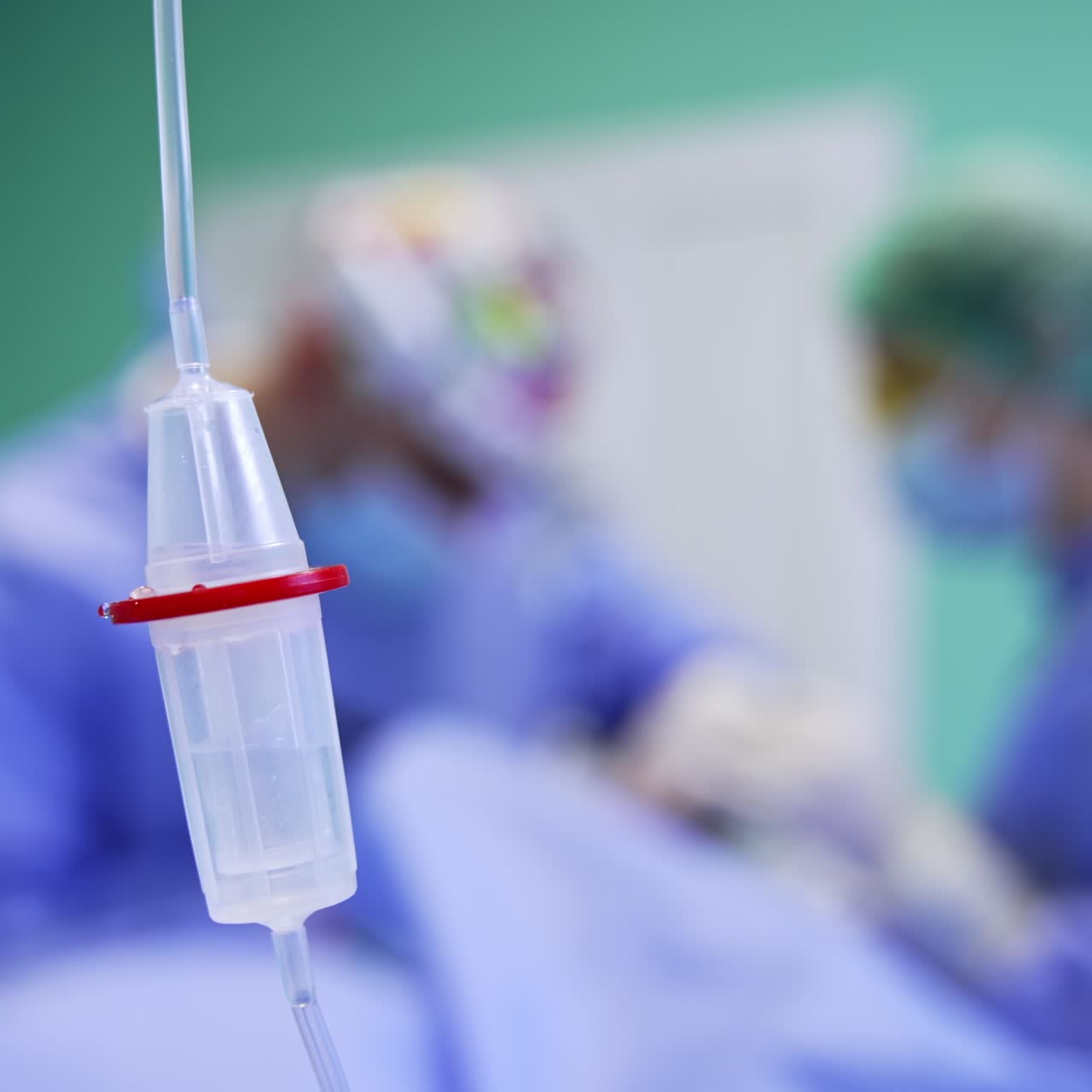 Drugs dropping inside the drop counter. Equipment in surgery room during operation. Close up. Blurred backdrop