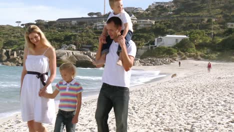 family walking on the beach