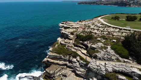 aerial view of the bondi beach lookout, sunny sydney, australia - descending, drone shot