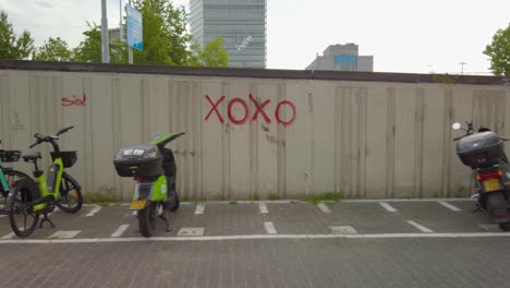 parking lot for delivery scooters and bicycles in the city of eindhoven in the netherlands