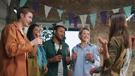 multiracial coworkers talking party in office. happy colleagues team celebrating