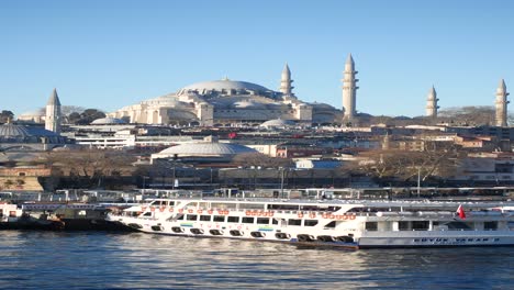 istanbul skyline with süleymaniye mosque and ferry boats