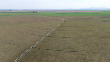 aerial view of vast farmland with center pivot irrigation systems. expansive agriculture.