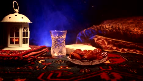 water and dates. iftar is the evening meal. slider view of decoration ramadan kareem holiday. festive greeting card, invitation for muslim holy month ramadan kareem. dark background. selective focus