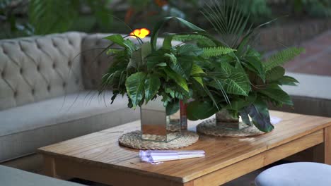 pan shot of arranging wedding decorations on a table