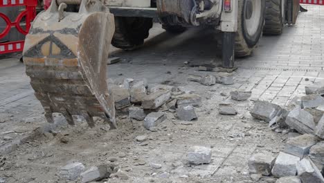 excavator removing pavement