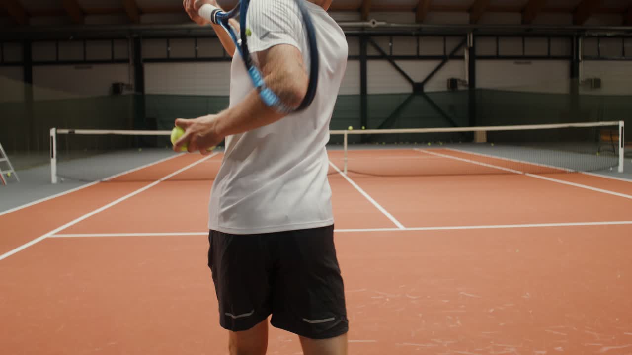 Man Playing Indoor Tennis