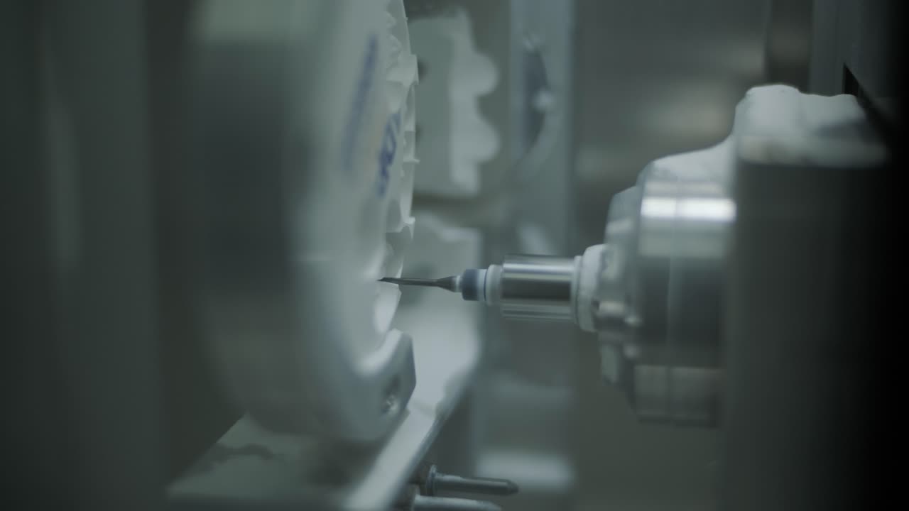 CNC Machine Cutting Zirconia Crowns from Unfired Zirconia