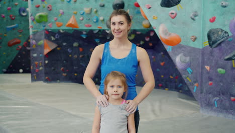 mother and daughter at climbing gym
