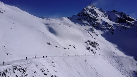 snowy mountain ski slope with skiers