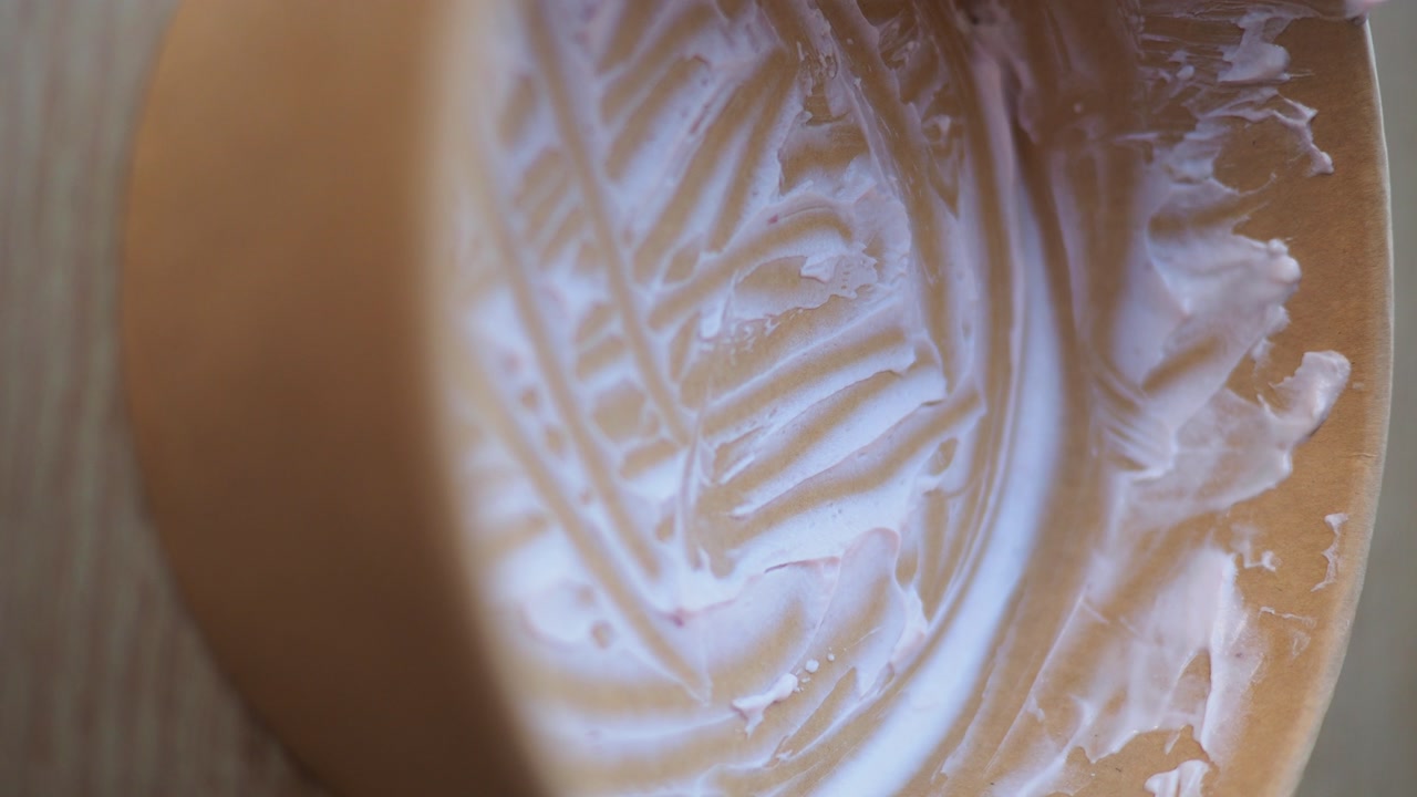 Close-up of Empty Disposable Bowl with Leftover Yogurt Cream