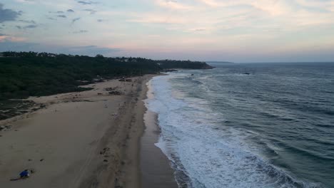 Punta-Zicatela-Beach-drone-video,-known-for-its-powerful-waves-that-make-it-an-ideal-destination-for-surfing