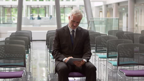 Businessman-In-Empty-Auditorium-Prepares-Speech-Shot-On-R3D