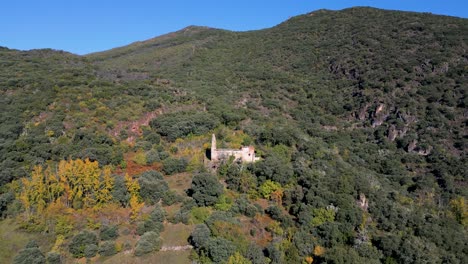 aerial view of abandoned ruins on a mountainside in autumn