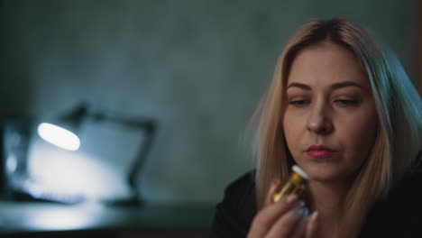 woman looks at bottle with biologically active additives