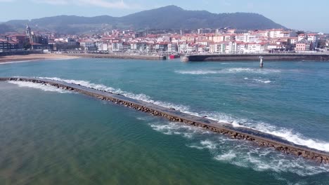 Drone-aerial-view-of-the-San-Nicolás-island-at-the-beach-of-Lekeitio-in-the-Basque-Country