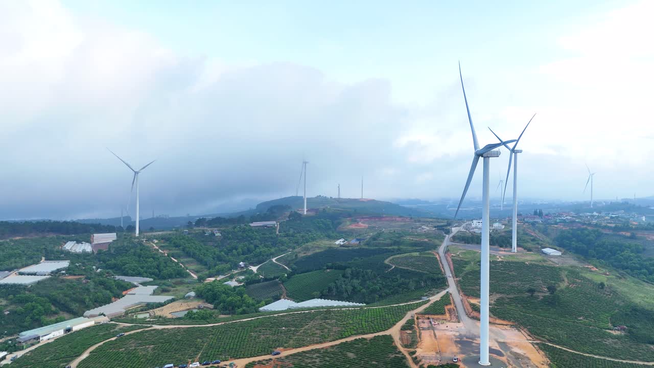 Wind power turbines on high hills in Vietnam at sunrise - Wind power