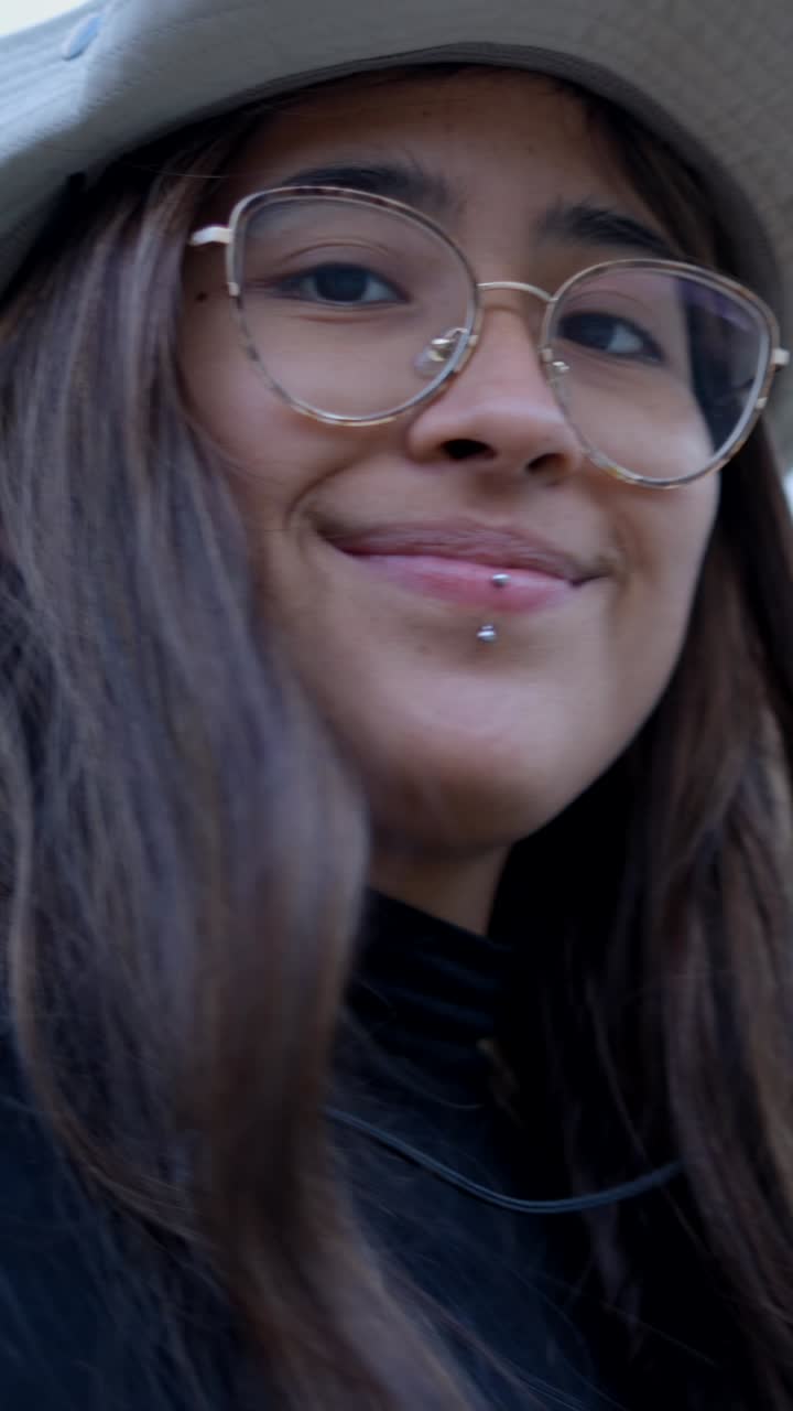 Close-up Portraits of a Young Woman with Glasses and a Lip Piercing