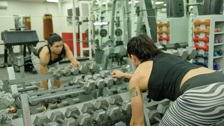 Active motivated female athlete training in gym