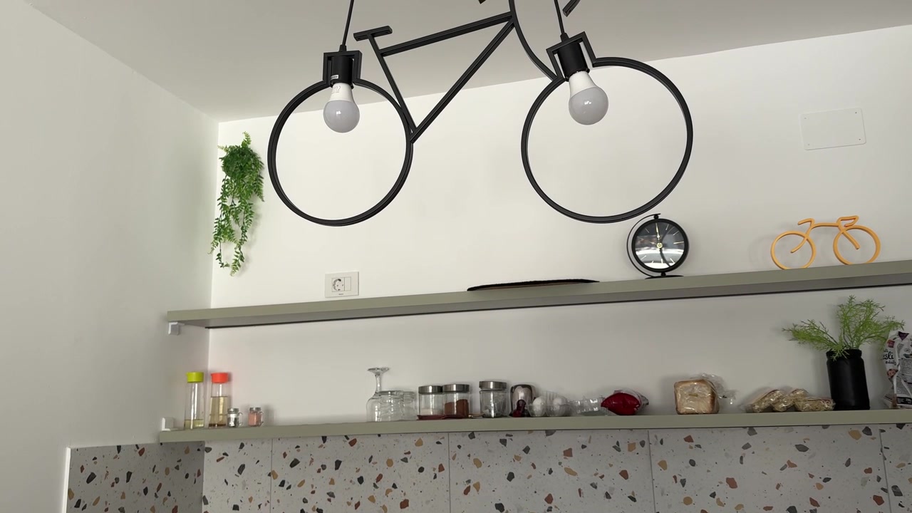 Decorative Bicycle Wall Display above Modern Kitchen Interior with Contemporary Home Decor
