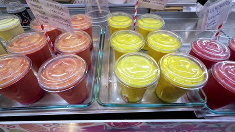 Steady-zoom-in-shot-of-various-flavors-of-organic-smoothie-in-Sevilla-Spain