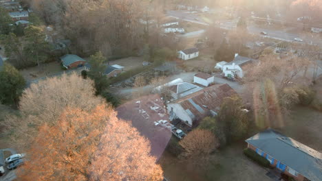 suburb houses garden exposed to road traffic in america, aerial