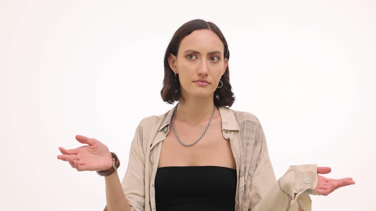 A brunette woman posing for the camera