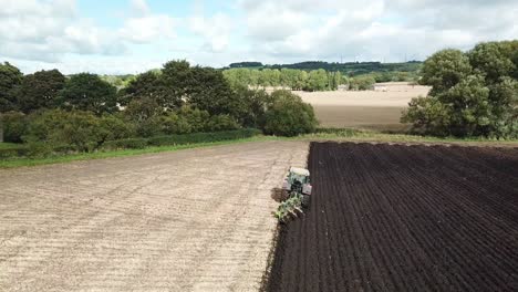 Aerial-footage-over-tractor-ploughing-field