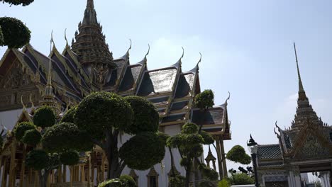 Slow-motion-revealing-shot-of-Dusit-Maha-Prasat-Hall-with-beautiful-gardens