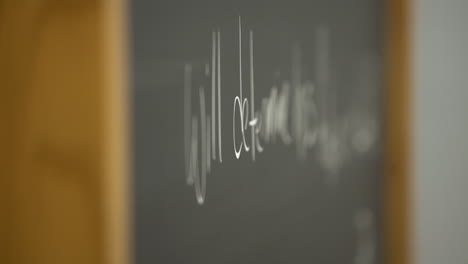 prisoner-inmate-writing-on-chalkboard-in-slow-motion-shot-on-Sony-A7III-mirrorless-camera