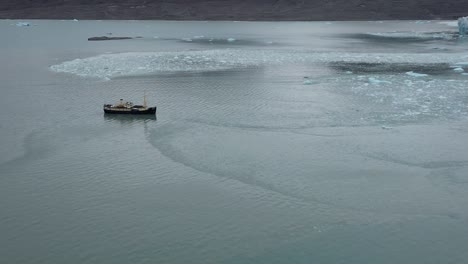 expedition boat in the arctic sea north of svalbard