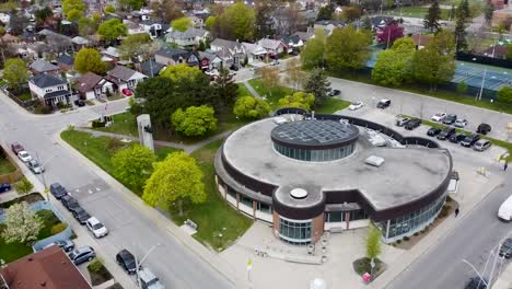 drone shot of a community centre in a foggy toronto neighborhood in the spring