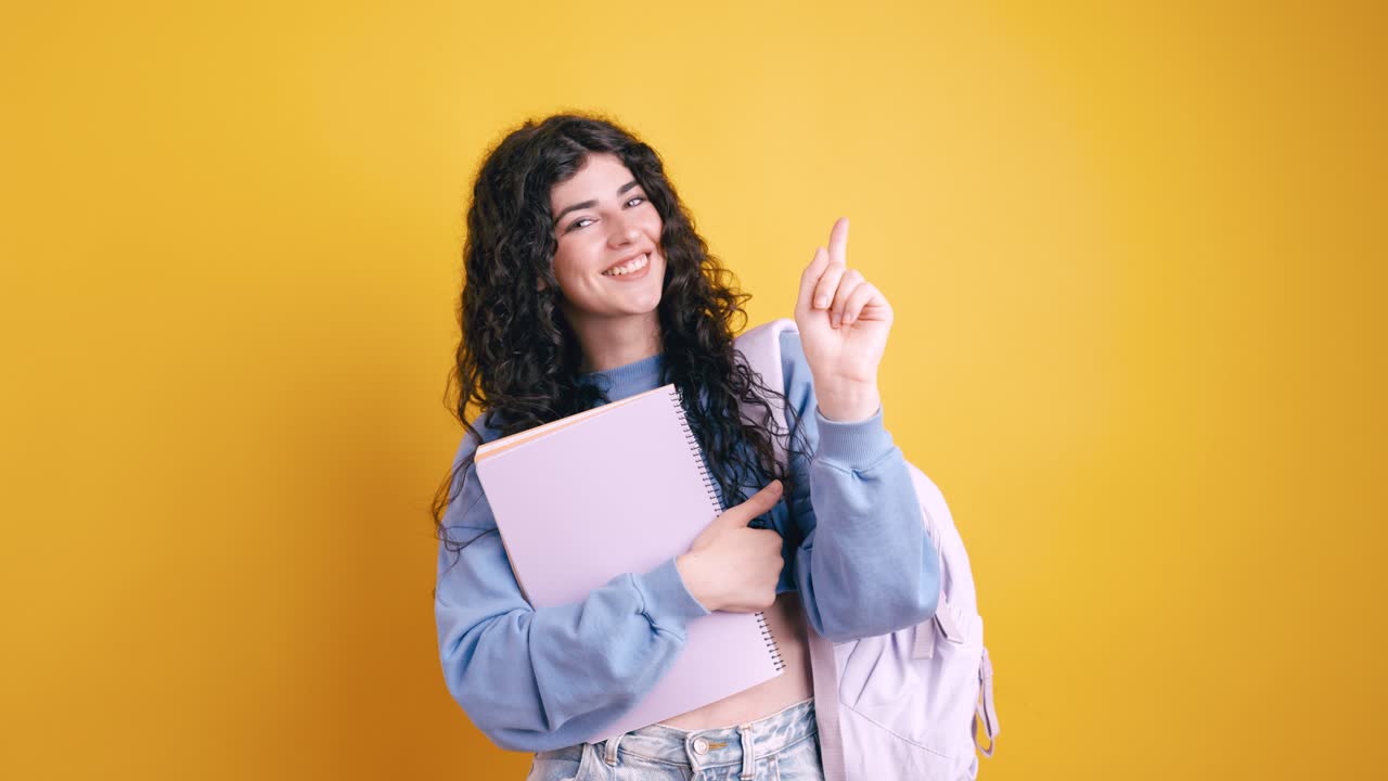 Teenage student with curly hair contemplating