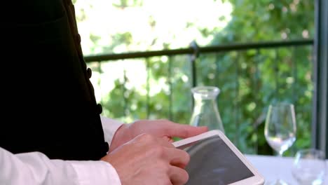 waiter using digital tablet